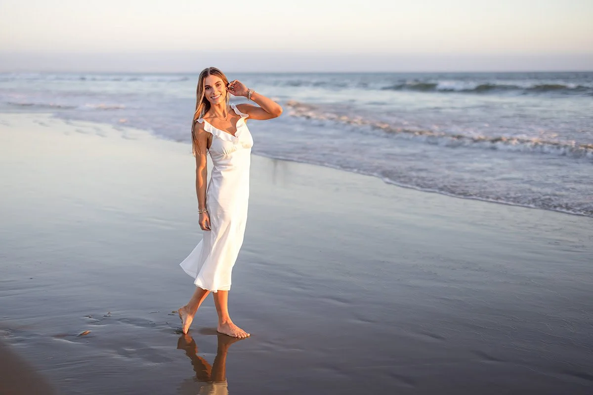 Cal Poly senior portrait on the beach during blue hour near Pismo Beach
