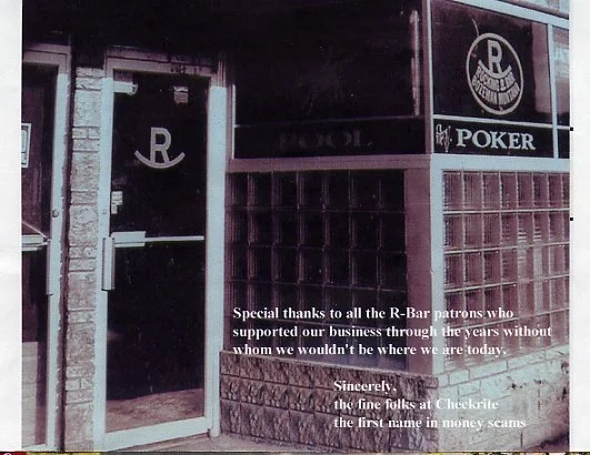 Entrance to a bar with a sign featuring a poker and pool icon, including a message thanking patrons and mentioning "Checkrite."