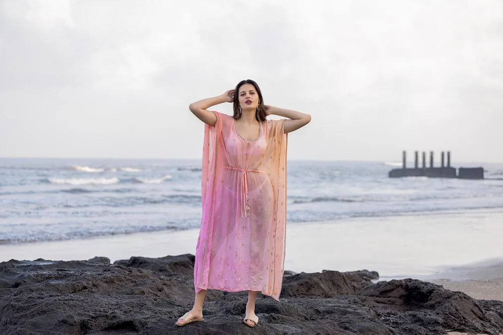 Sunset Rose Kaftan from KUMARI’s Jewels of Paradise collection, photographed on location.