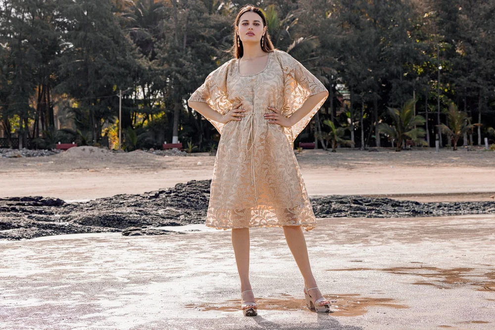 Goldleaf Oasis Kaftan from KUMARI’s Jewels of Paradise collection, photographed on location.