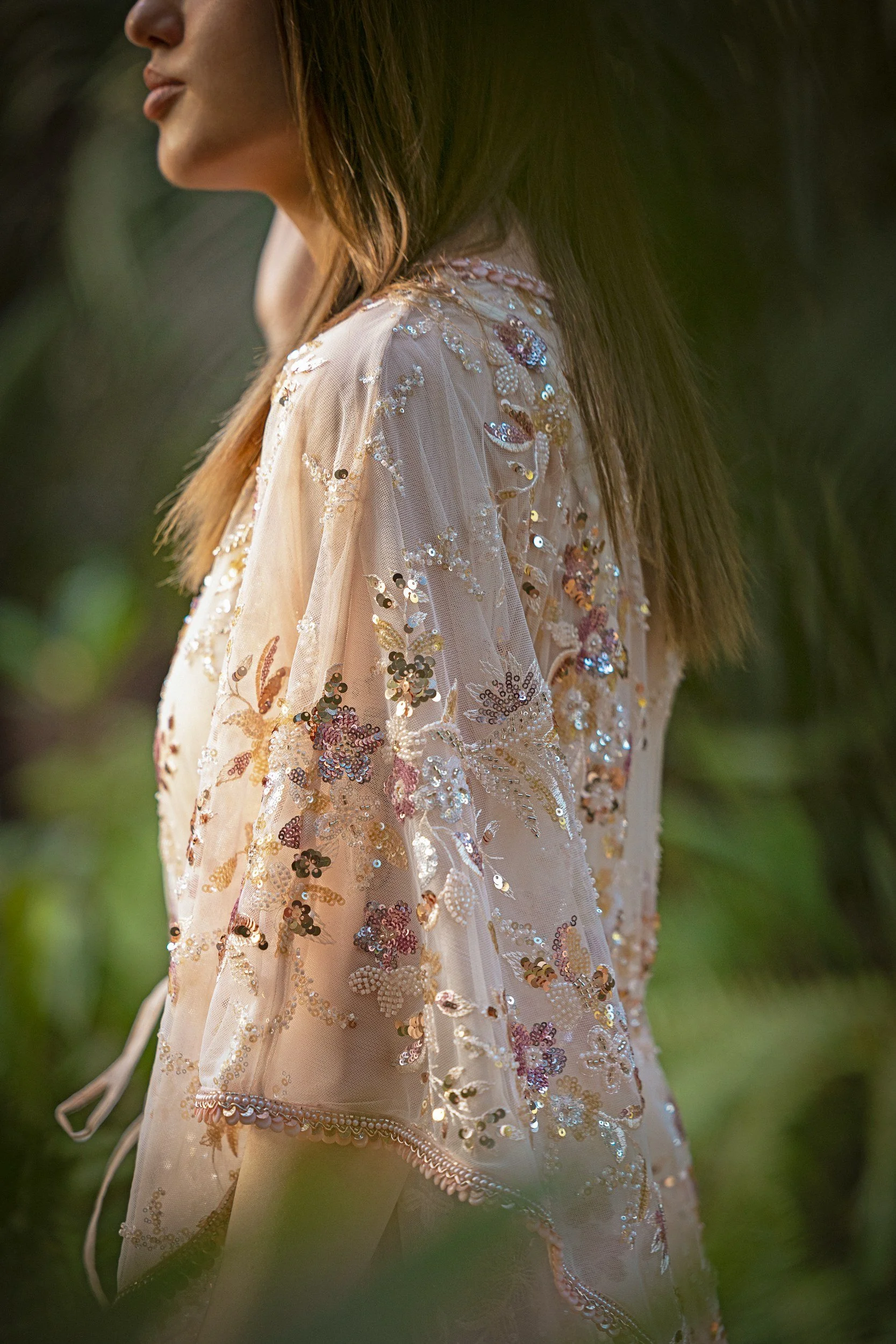 A close view of floral sequins and beadwork on the Pink Sapphire Blossom Kaftan.