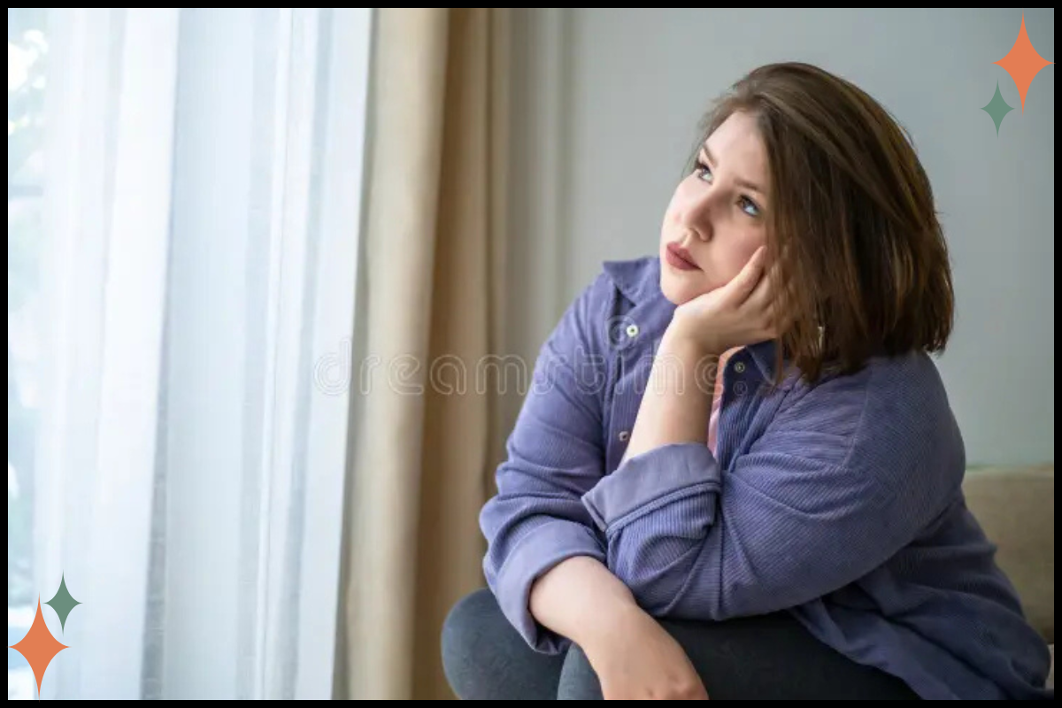 Person sitting quietly and reflecting in a calm space