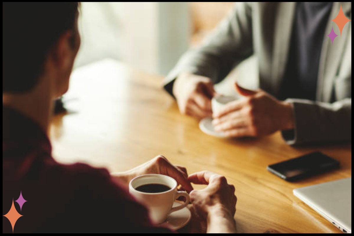 Two trauma therapists having coffee, illustrating supportive professional relationships in mental health practice
