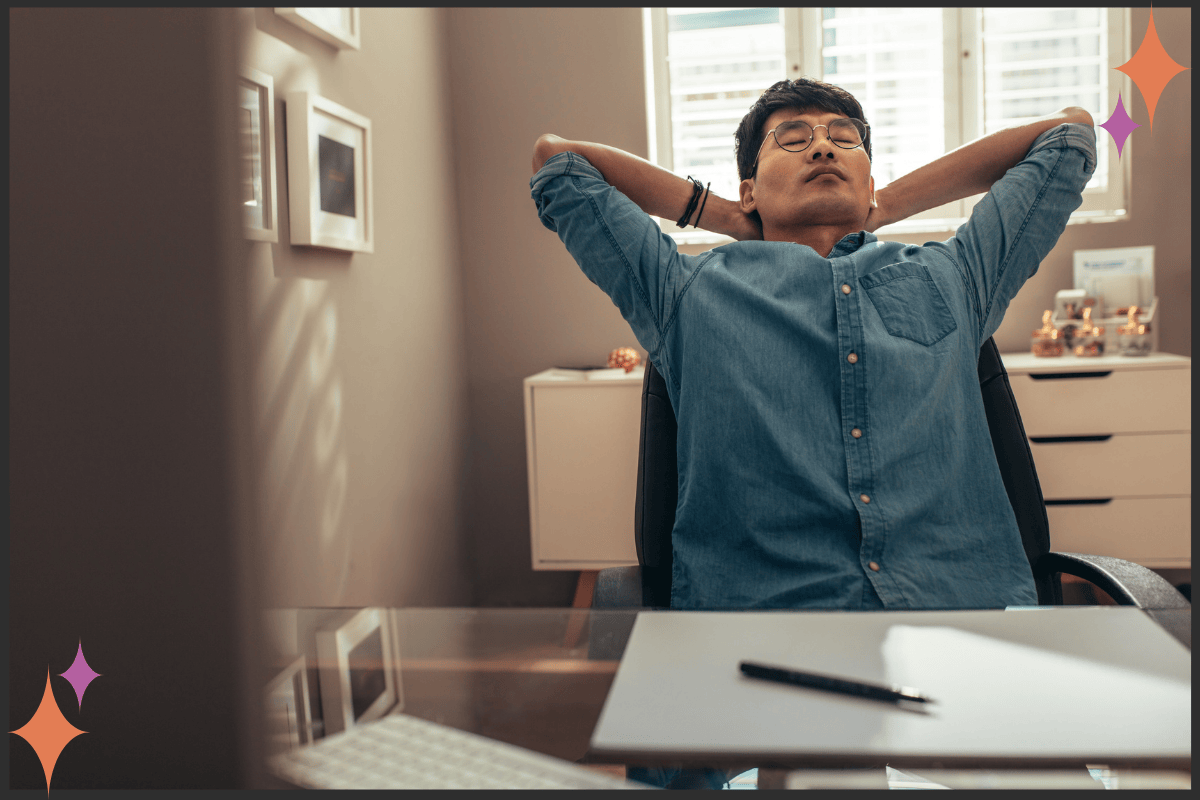 A therapist taking a mindful pause between sessions, engaging in a body-based resilience practice.
