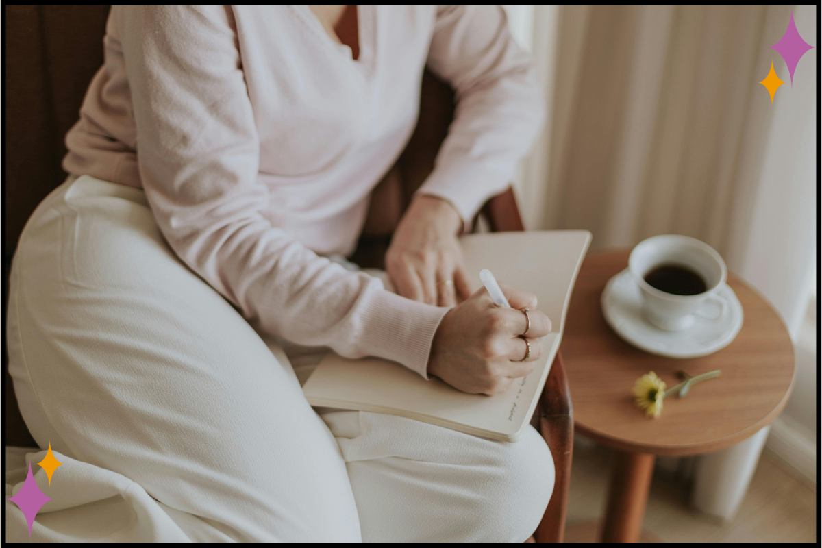 Person journaling by a window, representing self-reflection and trauma healing.