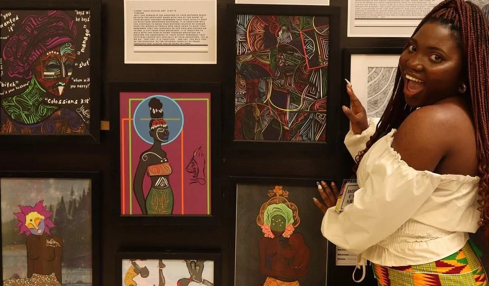 A woman posing excitedly at an art gallery with vibrant, colorful artwork featuring African themes and portraits displayed on the wall.