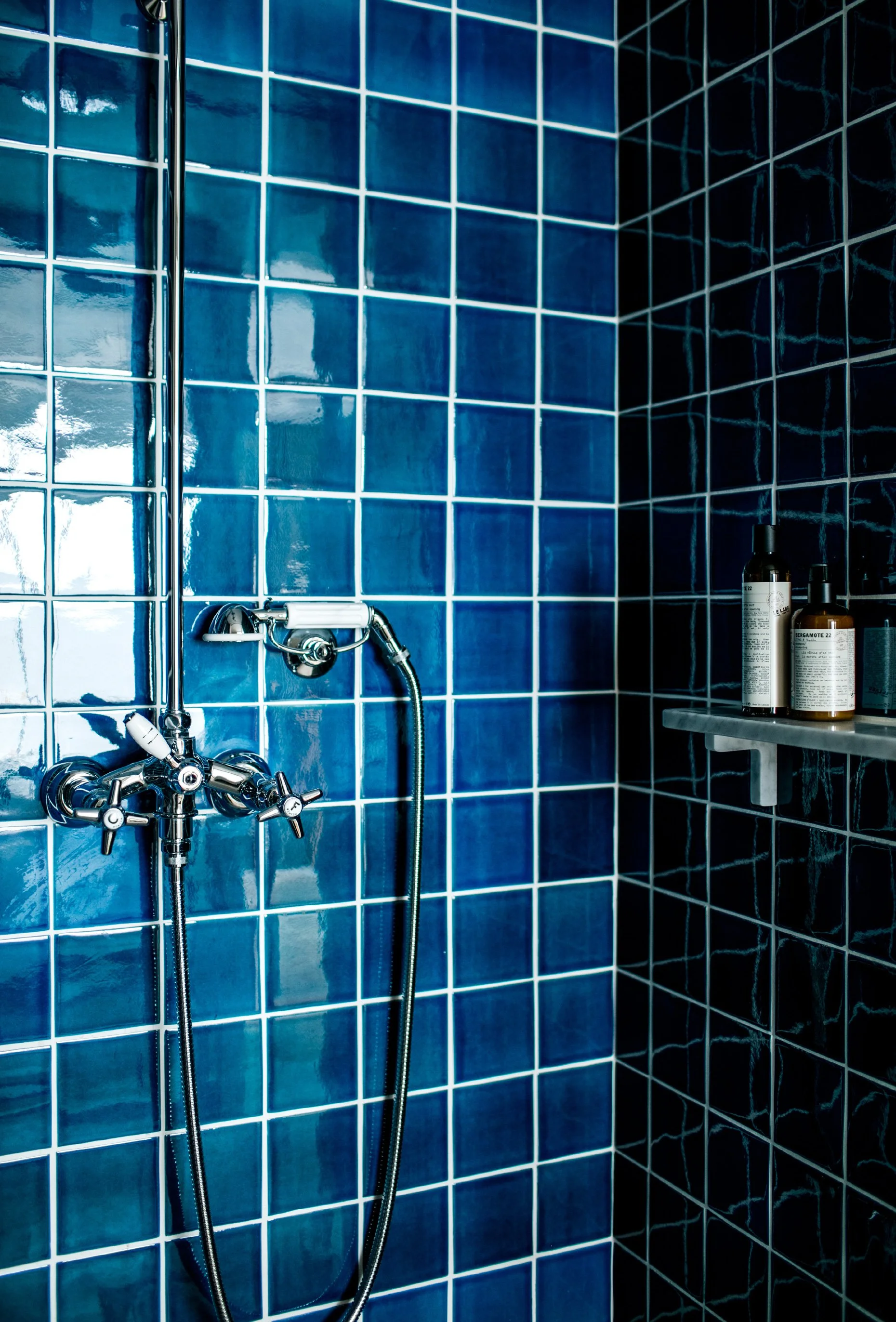 hotel-les-roches-rouges-shower-blue-tiles-interior-design-318_EXPLOY.jpg