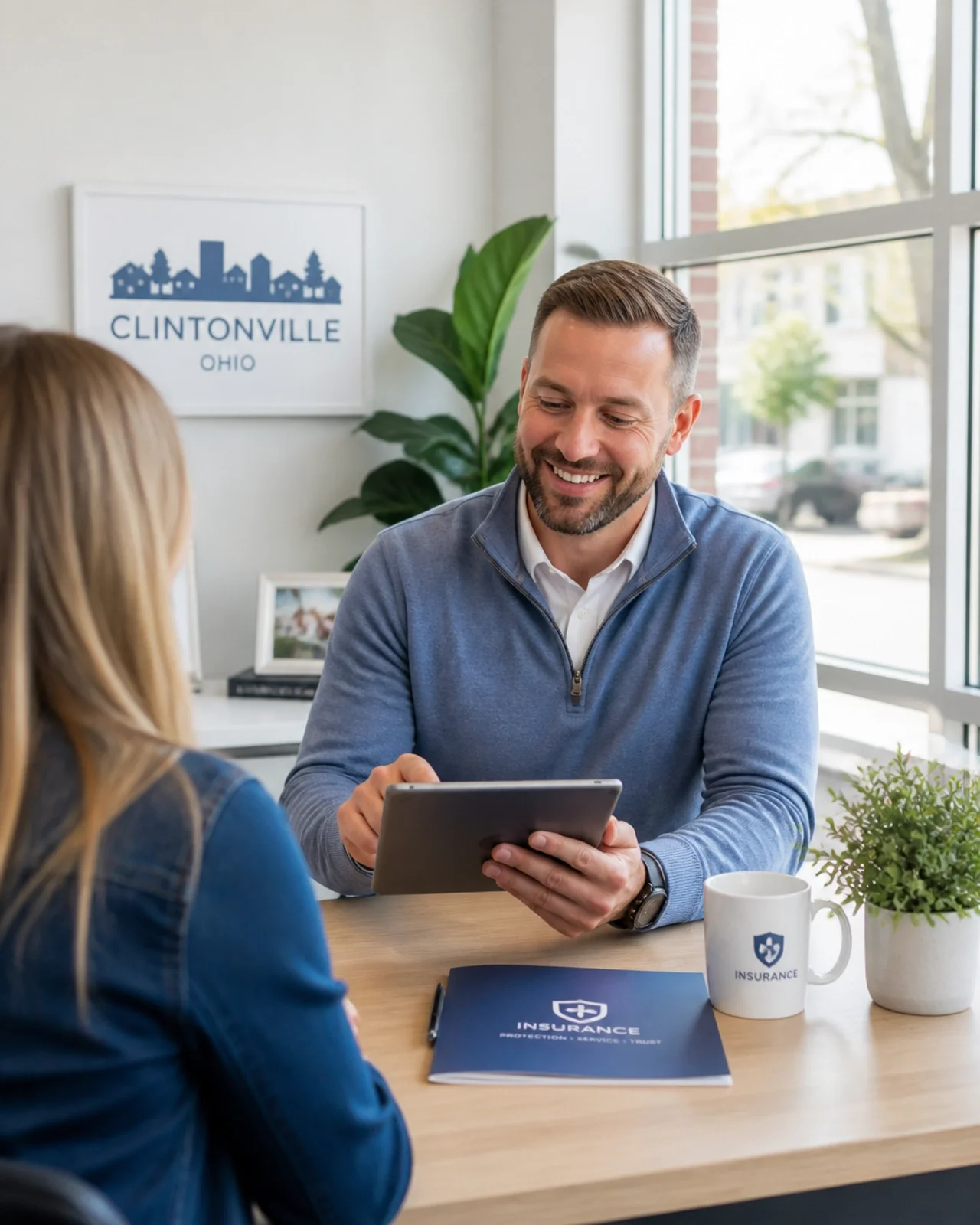 Ohio insurance agent reviewing auto insurance coverage options with a customer during a policy consultation.