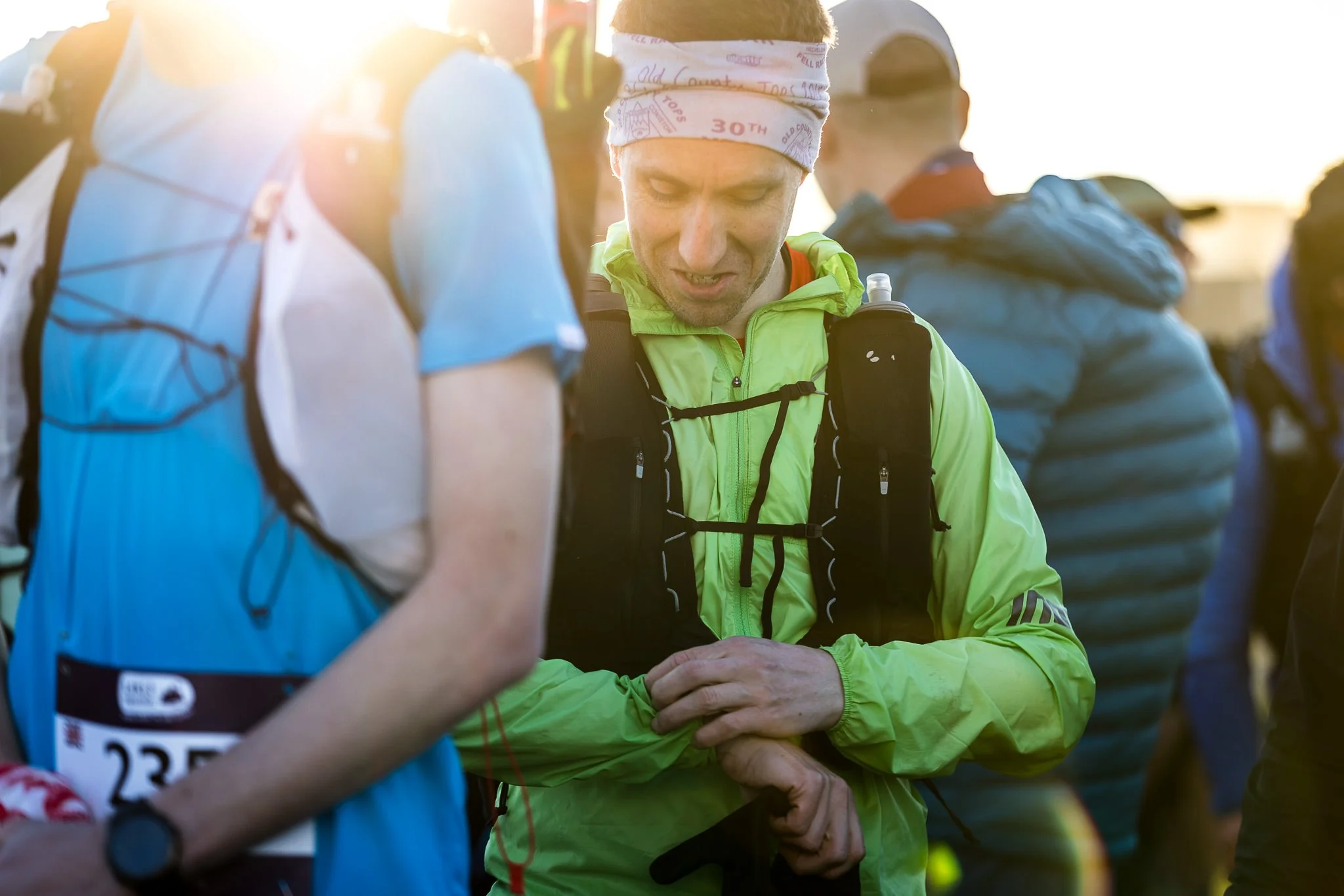 Lakes Traverse competitor setting his GPS watch as he waits eagerly at the start line