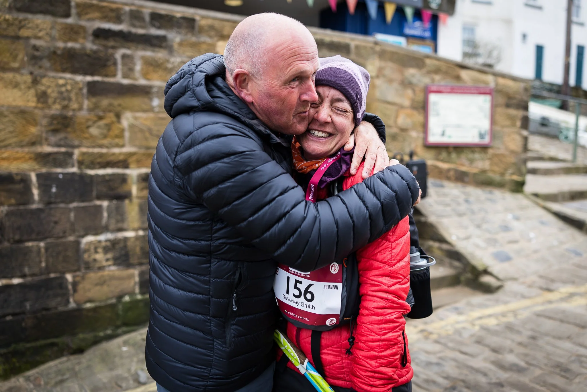 Proud family greet participants at the end of their epic journeys 