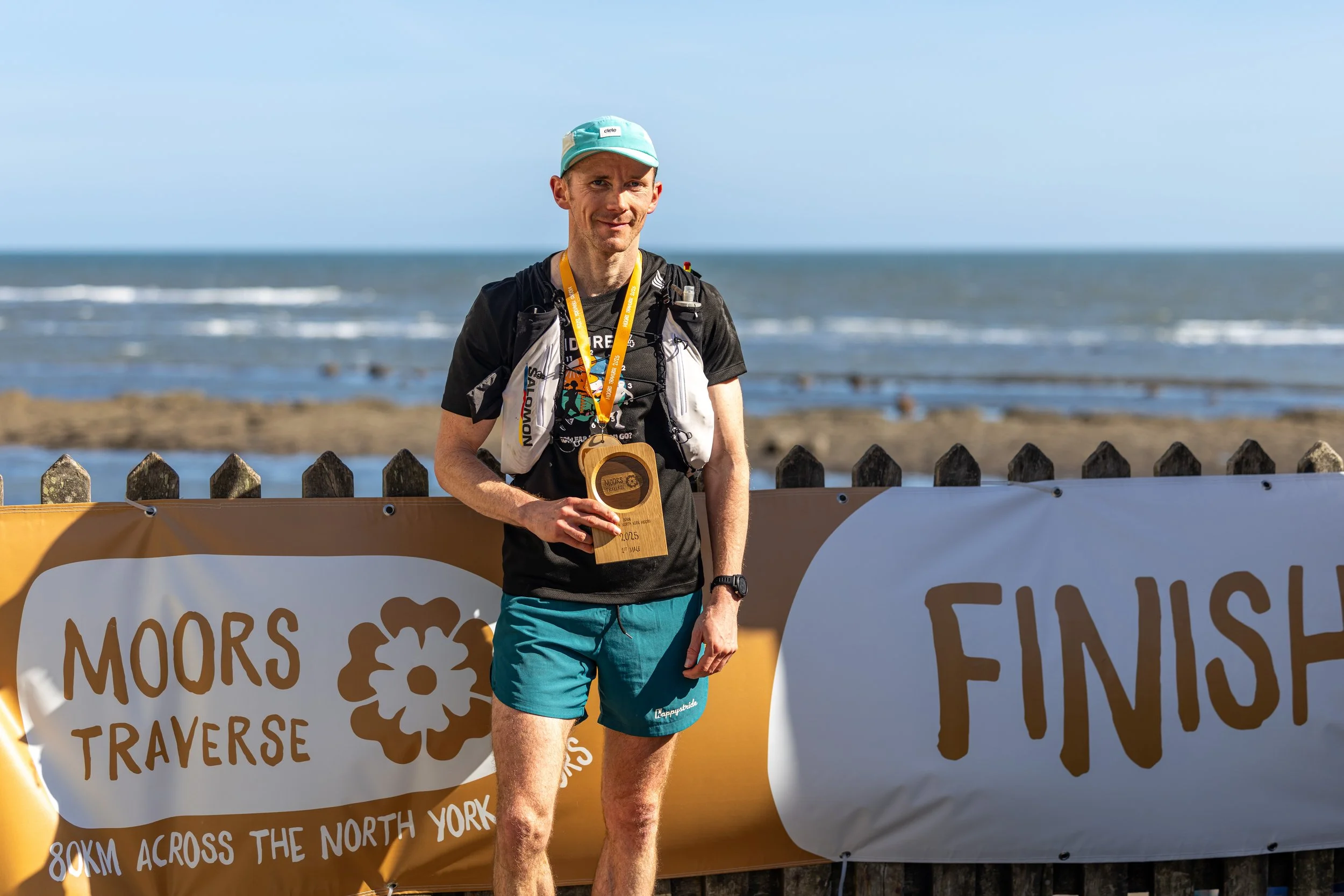 Moors Traverse first man soaking up the sunshine at Robin Hood's Bay