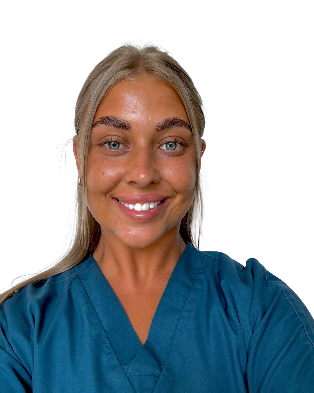 Young woman with blonde hair and blue eyes wearing blue medical scrubs, smiling against a white background.