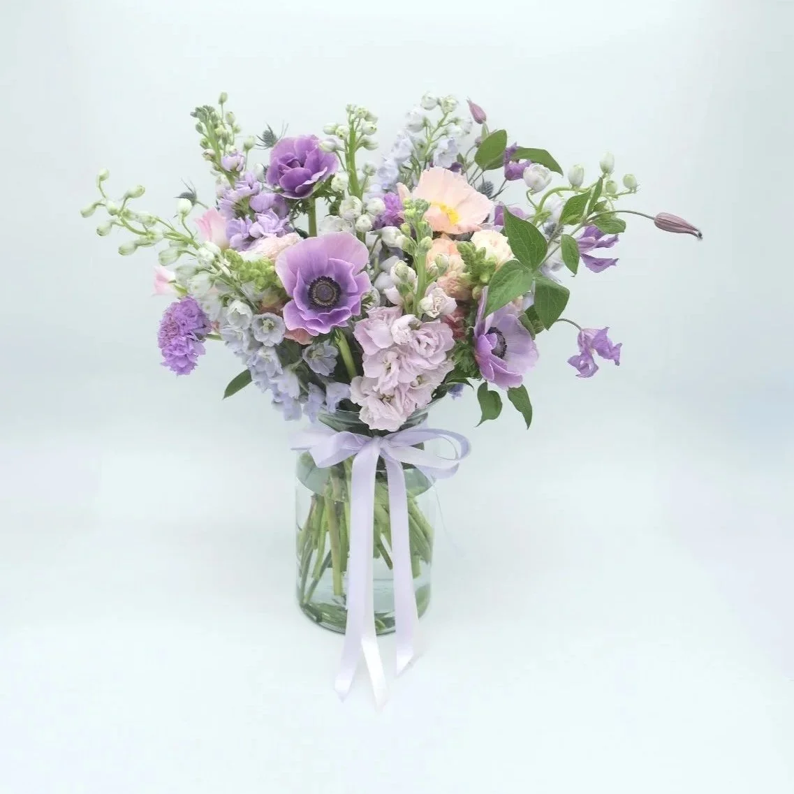 lavender-haze-mothers-day-bouquet-with-anemones-poppies-and-other-spring-blooms.jpg