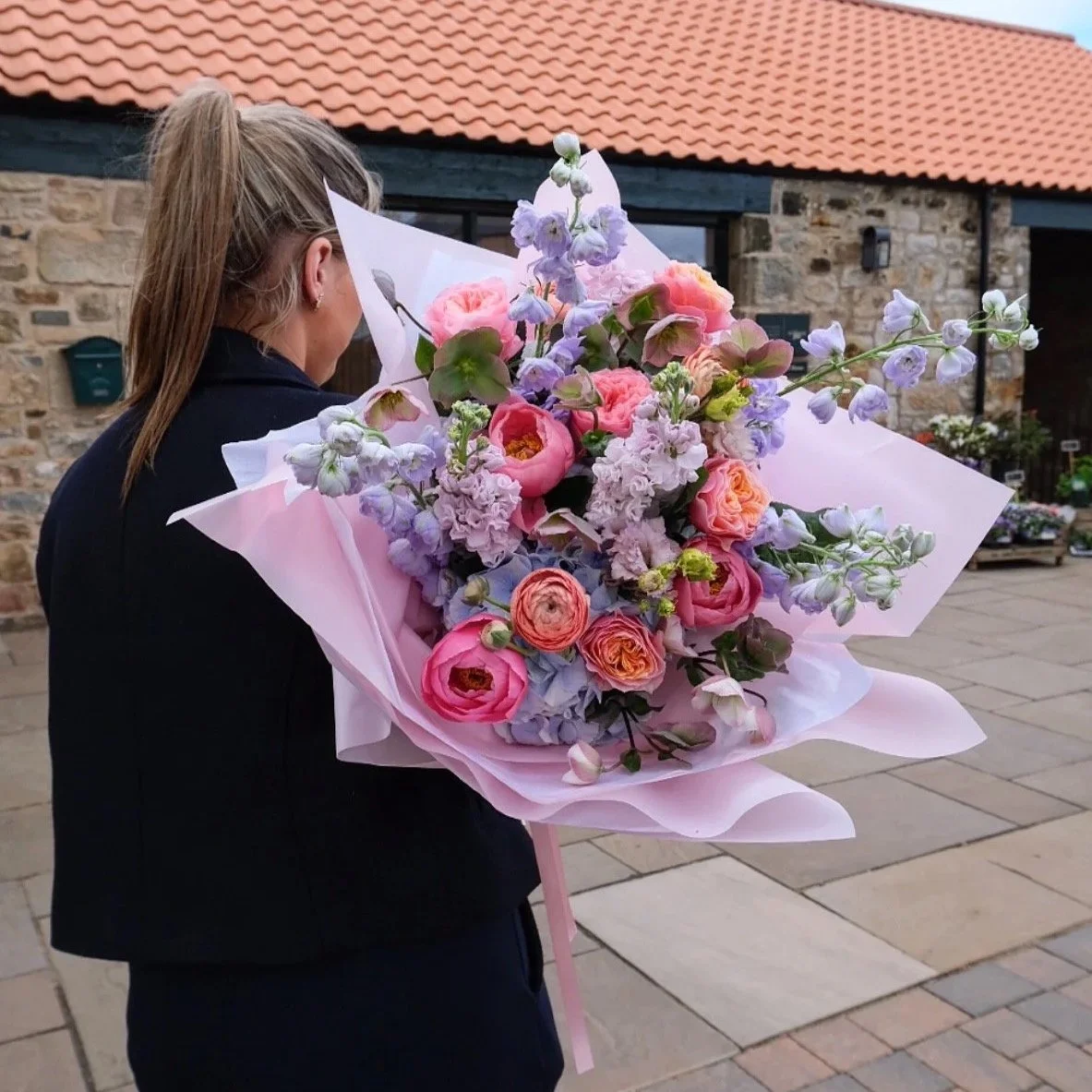pastel-punch-bouquet-with-peonies-roses-and-delphiniums-wrapped-in-blush-pink-east-lothian-florist.jpg