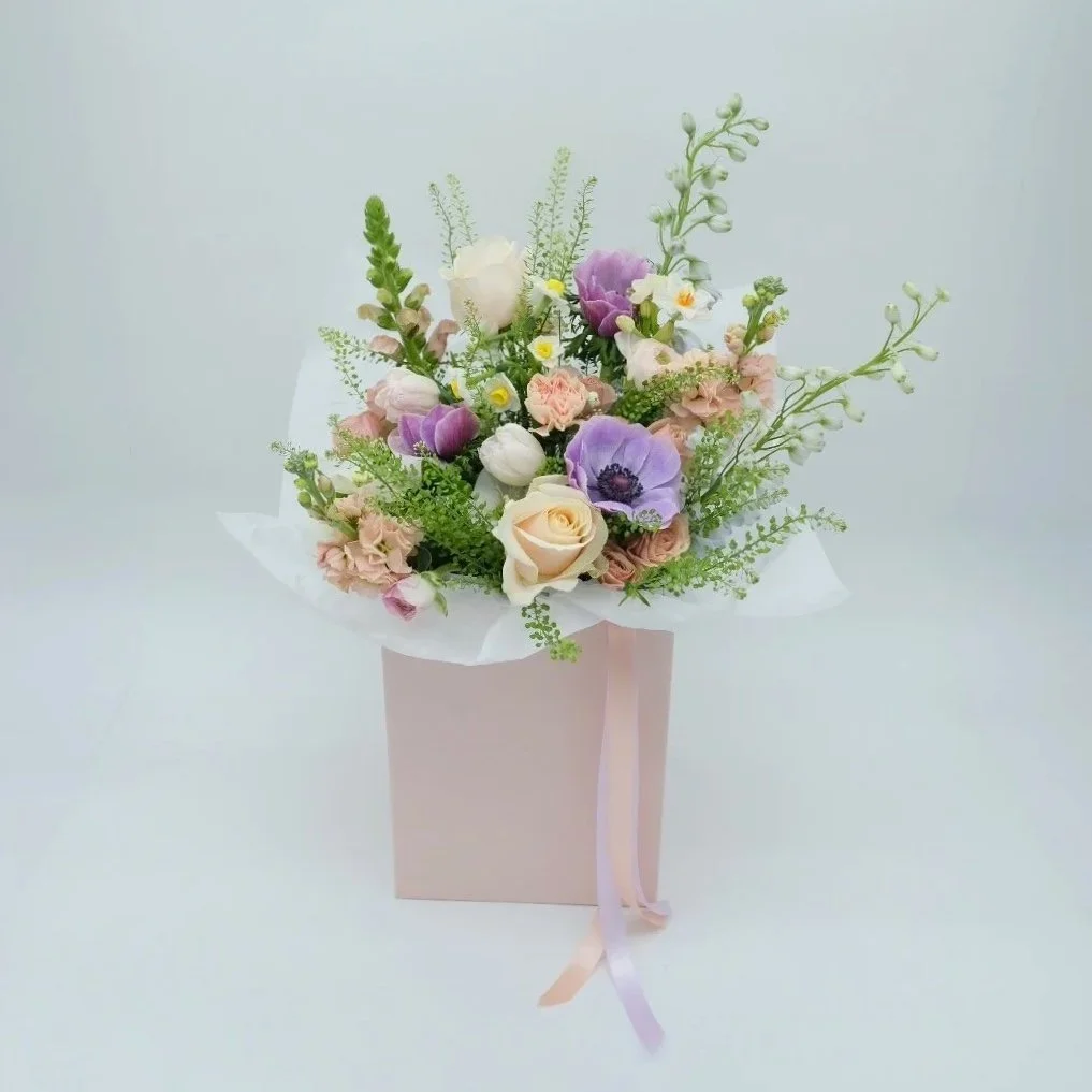 scents-of-spring-mothers-day-bouquet-with-roses-ranunculus-daffs-and-delphiniums+.jpg