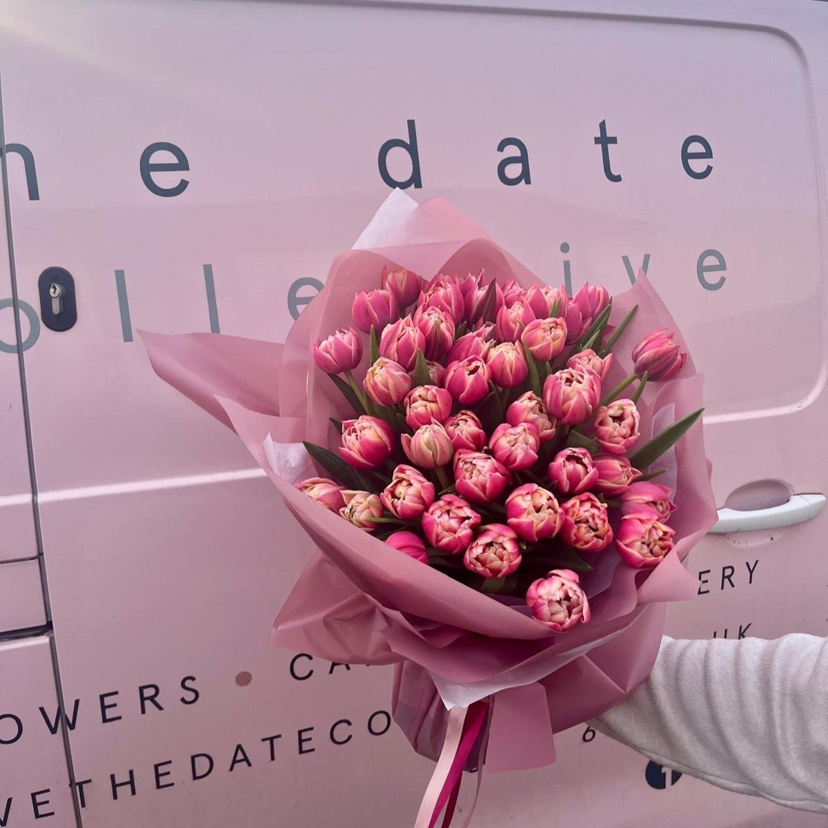 Weekly tulip bouquet in front of florist delivery van edinburgh