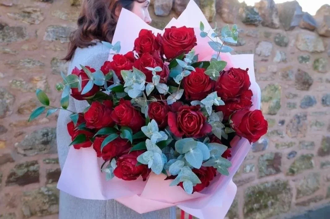 red-rose-valentines-bouquet-with-long-stems-and-wrapped-in-pink-available-for-local-and-uk-wide-delivery