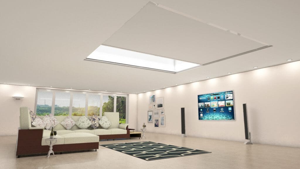 Modern living room with a large beige and brown sectional sofa, decorative pillows, a flat-screen TV on the wall, a black and white geometric rug, and large windows showing a scenic landscape.