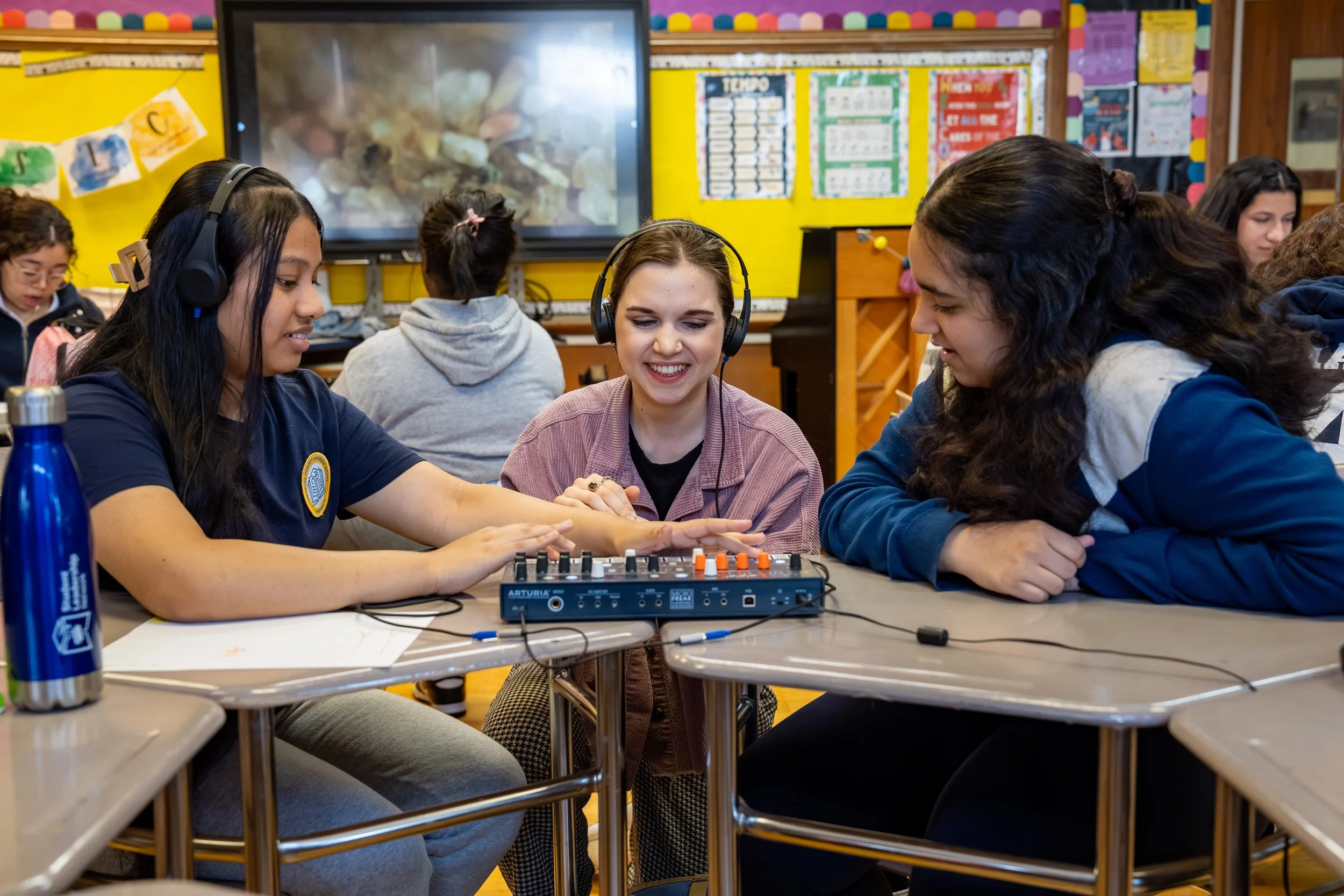 Willie Mae instructor and students using music mixing equipment