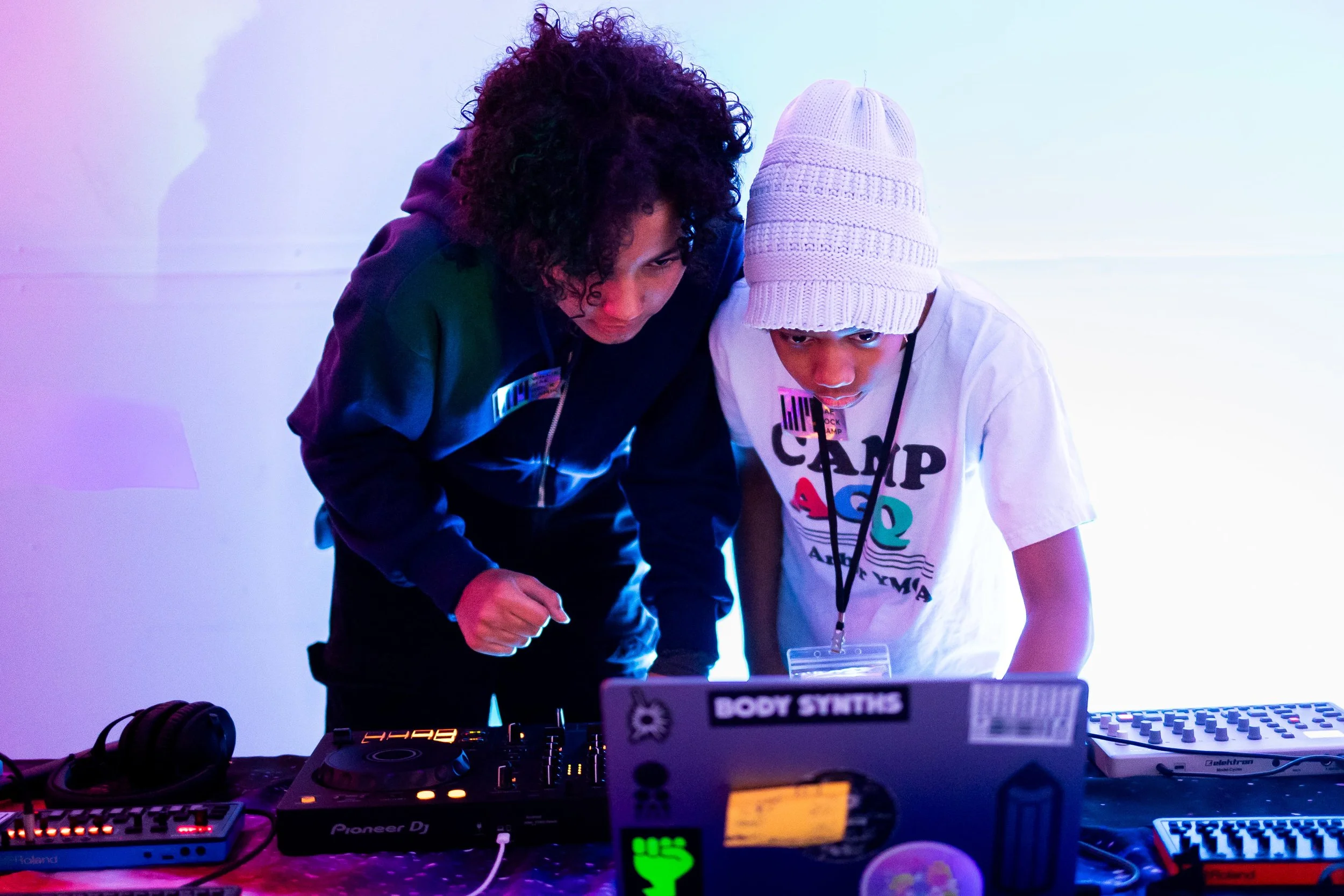 Student and coach using djing equipment