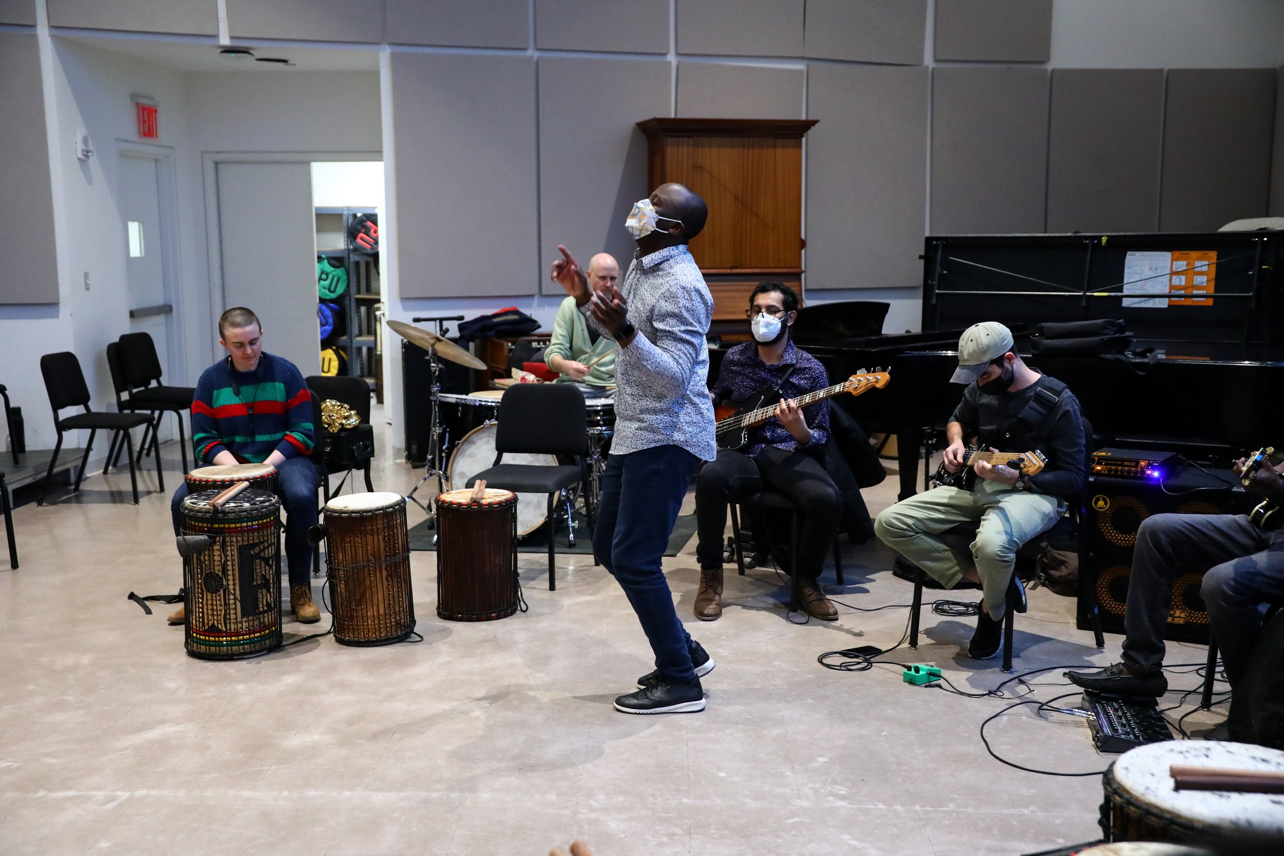 Olivier demonstrates a dance for his ensemble students.