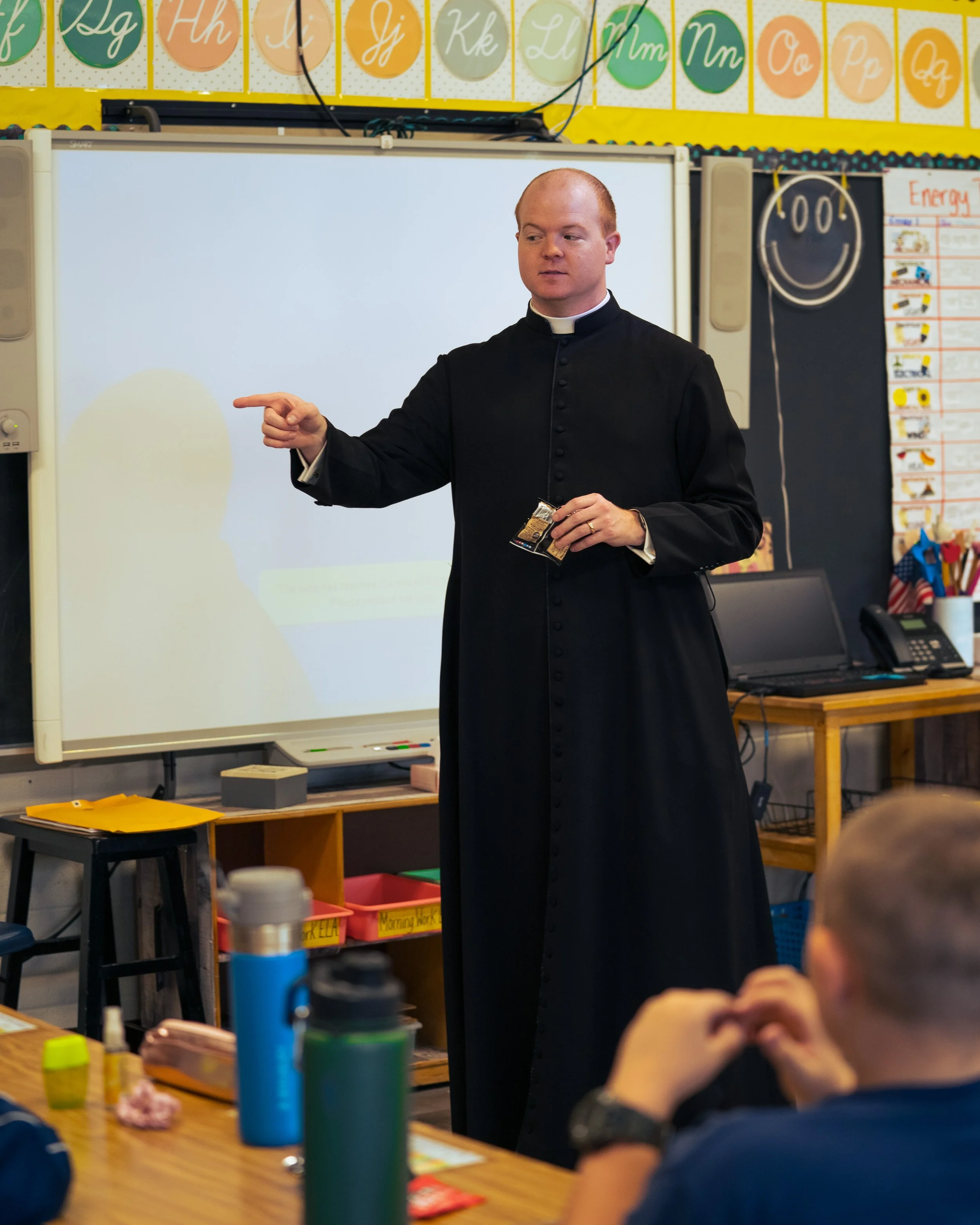 Catholic priest visits catholic school classroom: Catholic social media manager in New York, in the Diocese of Rockville Centre
