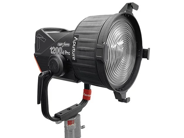 A professional studio LED light with a black and gray body, mounted on a stand with a red adjustment strap.