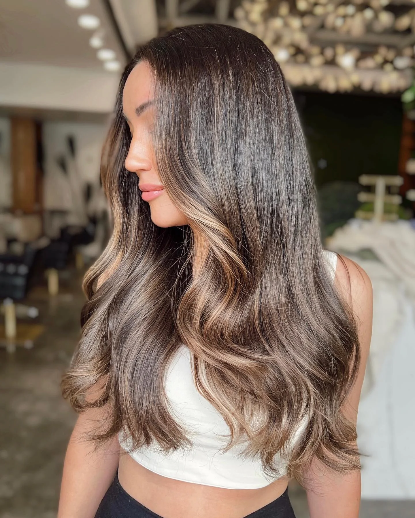 Sun-kissed bronde will always be the move ✨ I did a free-hand balayage application to bring a touch of dimension into this beauty&rsquo;s natural brunette base. Glossed with 7GB + 09AA + splash of 08V because y&rsquo;all know I loooove mixing warm an
