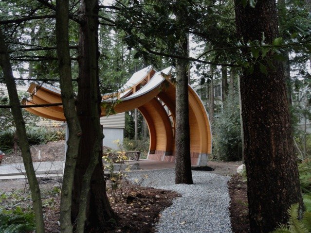 View of Pavilion A through the forest.