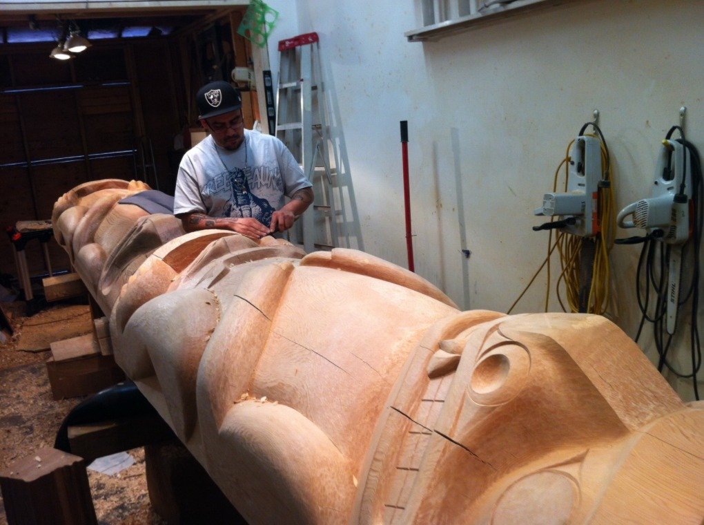 Final touches on the Bear House posts before they are stained and tranported to site for installation in Pavilion A.