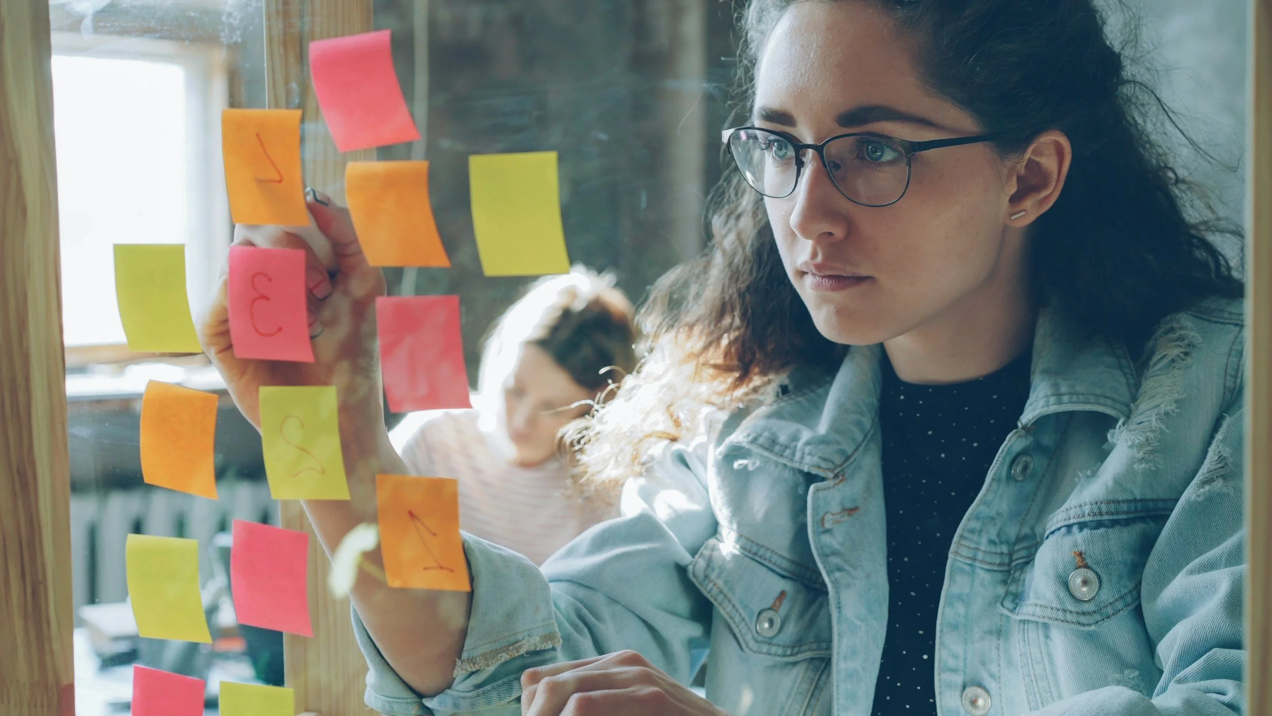 Image of woman with many post-it notes