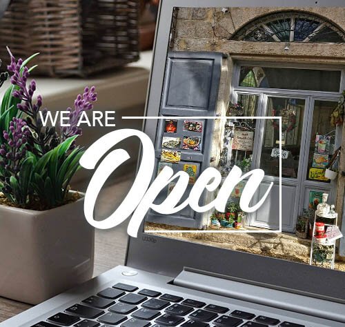 Store front with open sign on computer screen