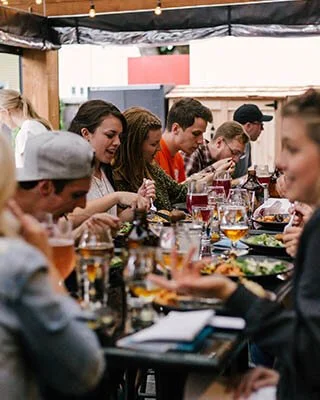 people enjoying dinner with friends