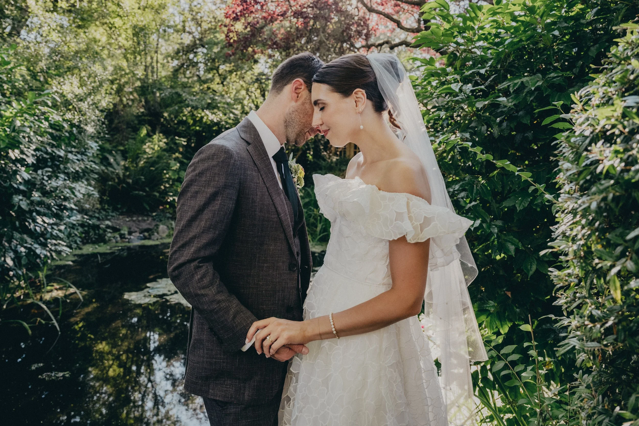Bride and groom near pond on Galiano Island