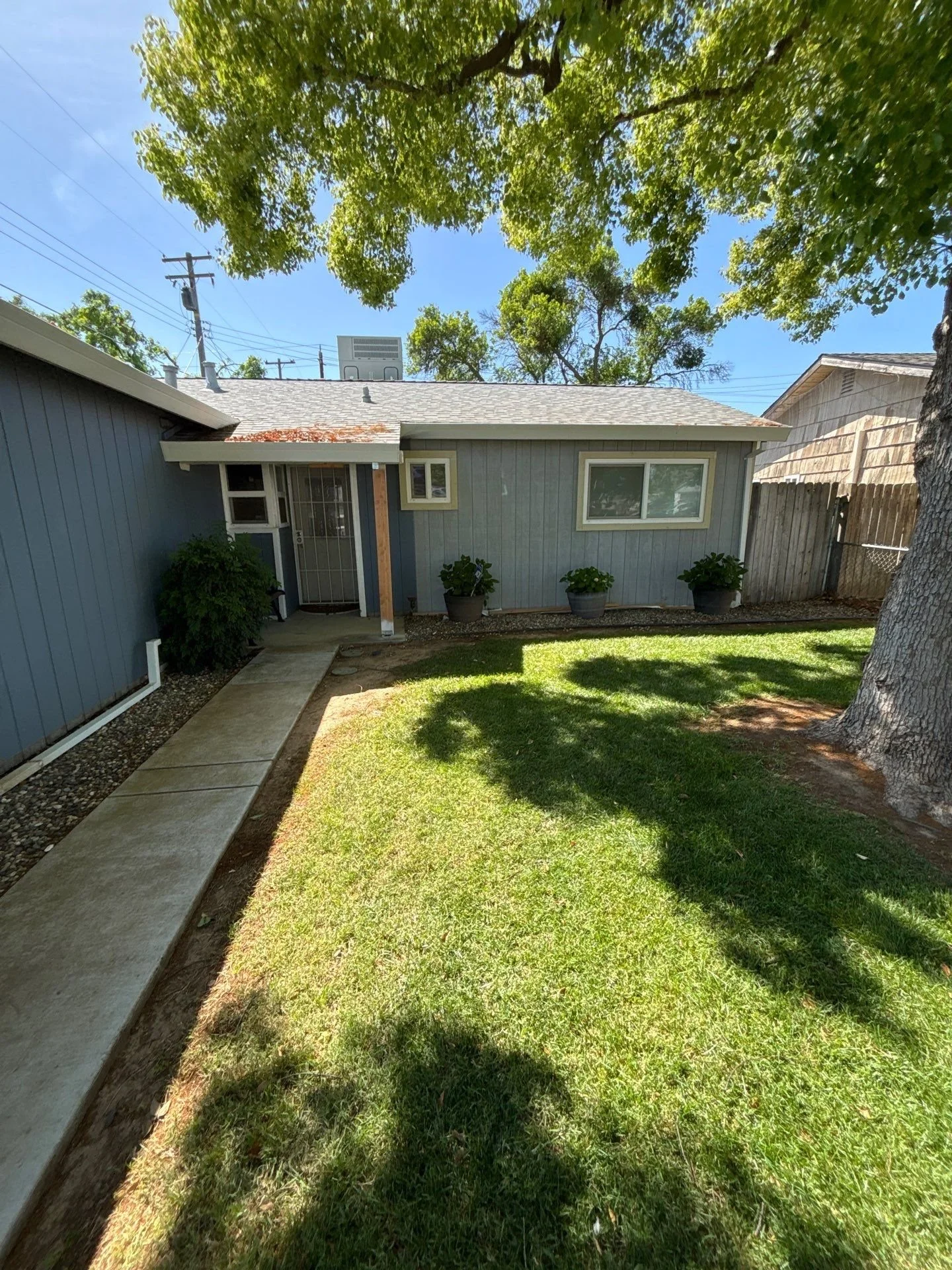 Rio Linda home with faded blue-gray siding before dry rot repair