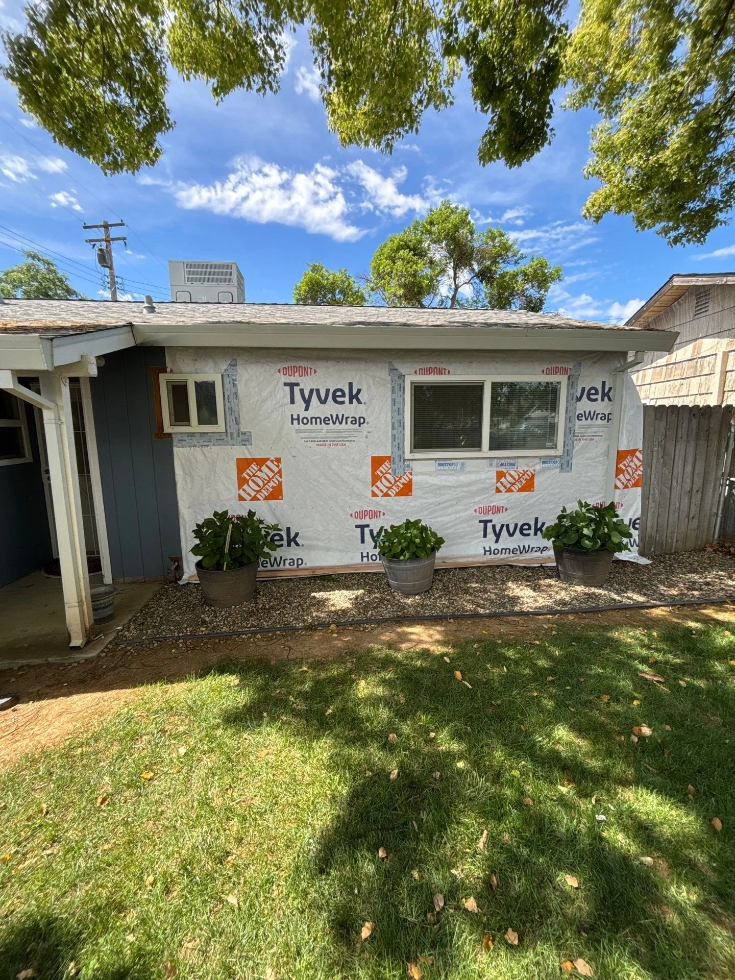 Front of a Rio Linda home wrapped in Tyvek before new siding was installed