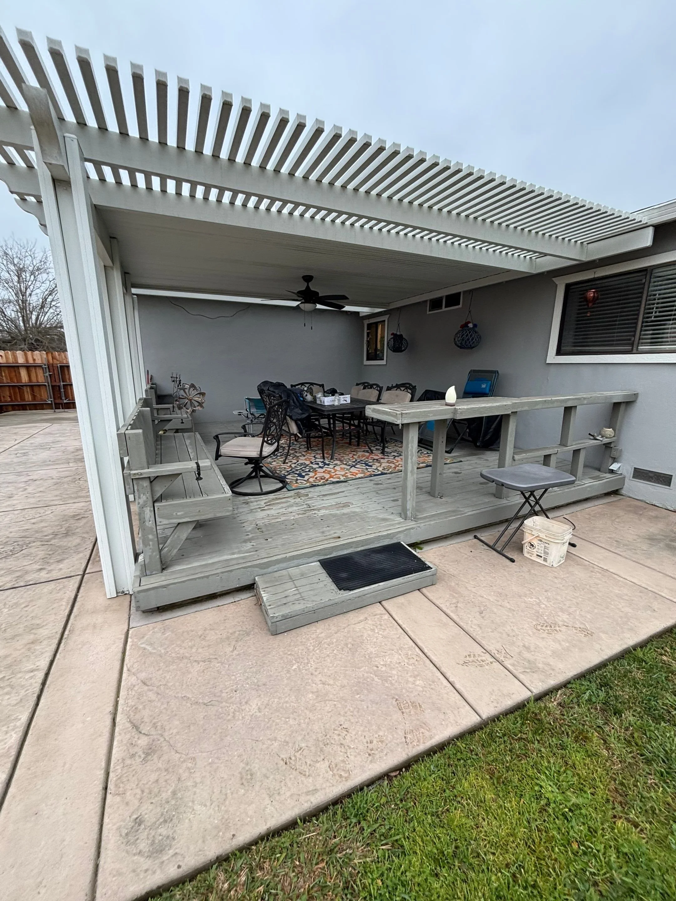 Finished repainted covered patio deck after dry rot repair in Rio Linda