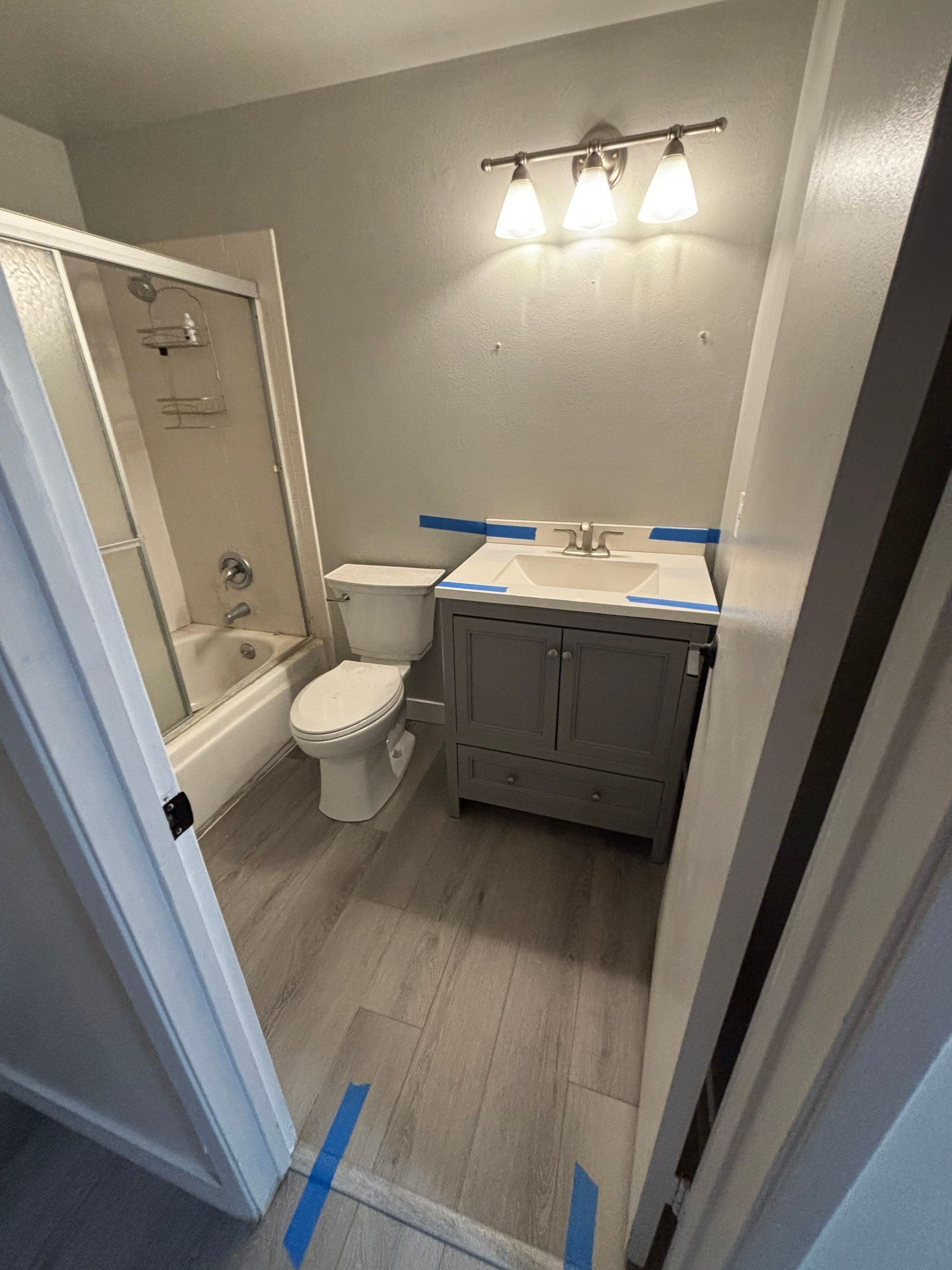 Finished bathroom remodel with new vanity and flooring in Rocklin