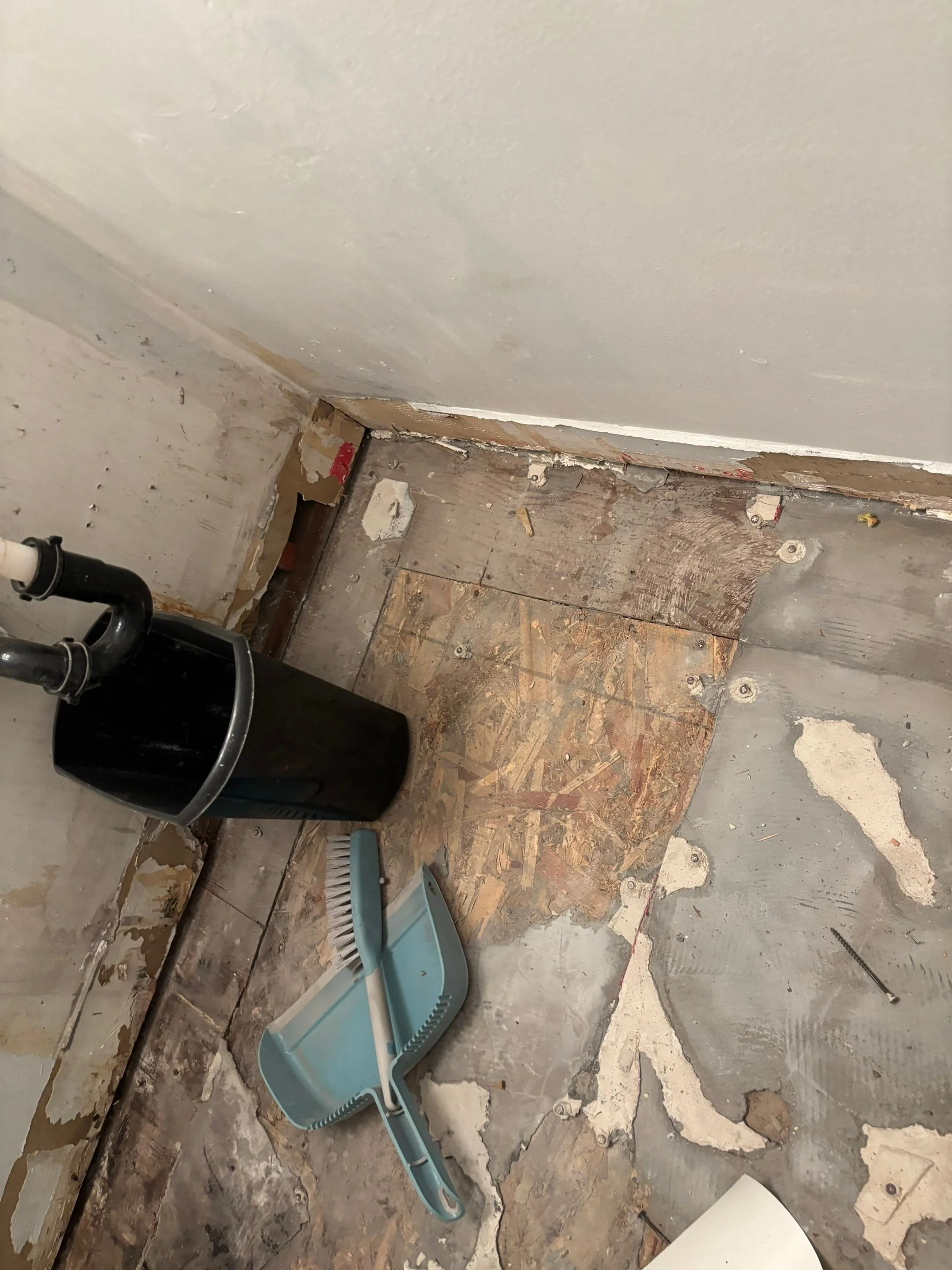 Water-damaged bathroom subfloor before repair in Rocklin