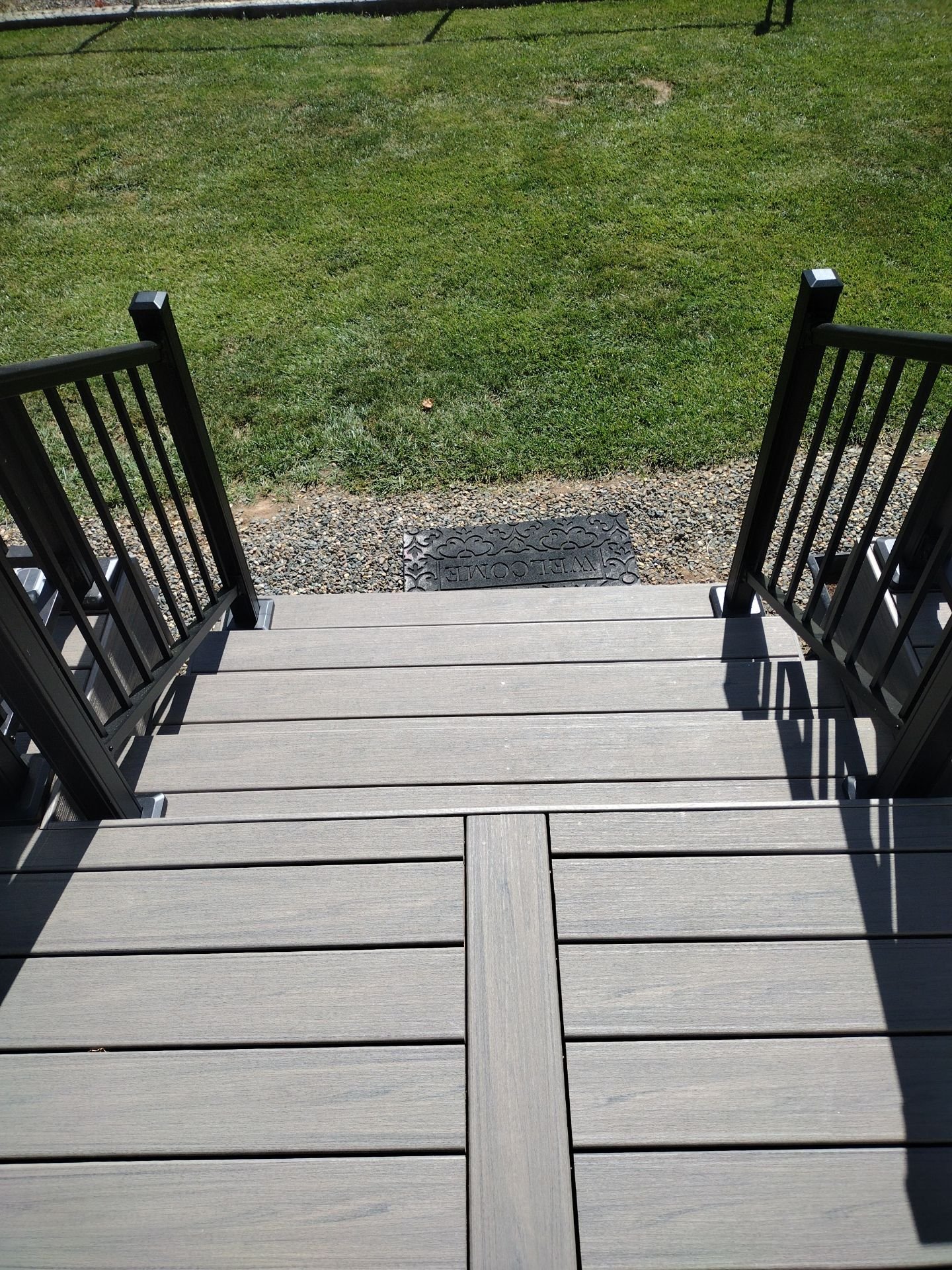 New gray composite deck steps with black railings in Rio Linda, CA
