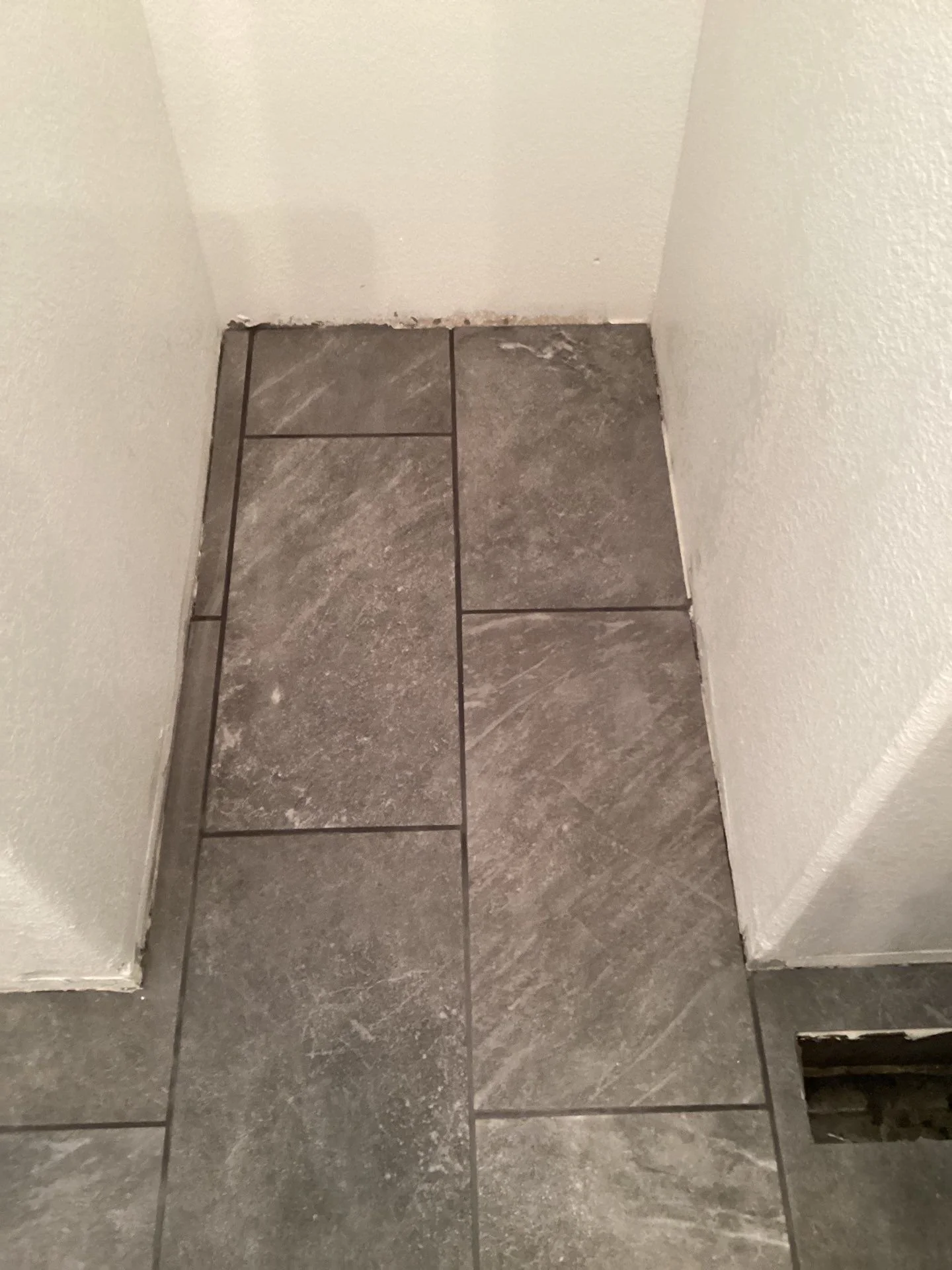 New gray tile floor going in during a bathroom remodel in Rio Linda