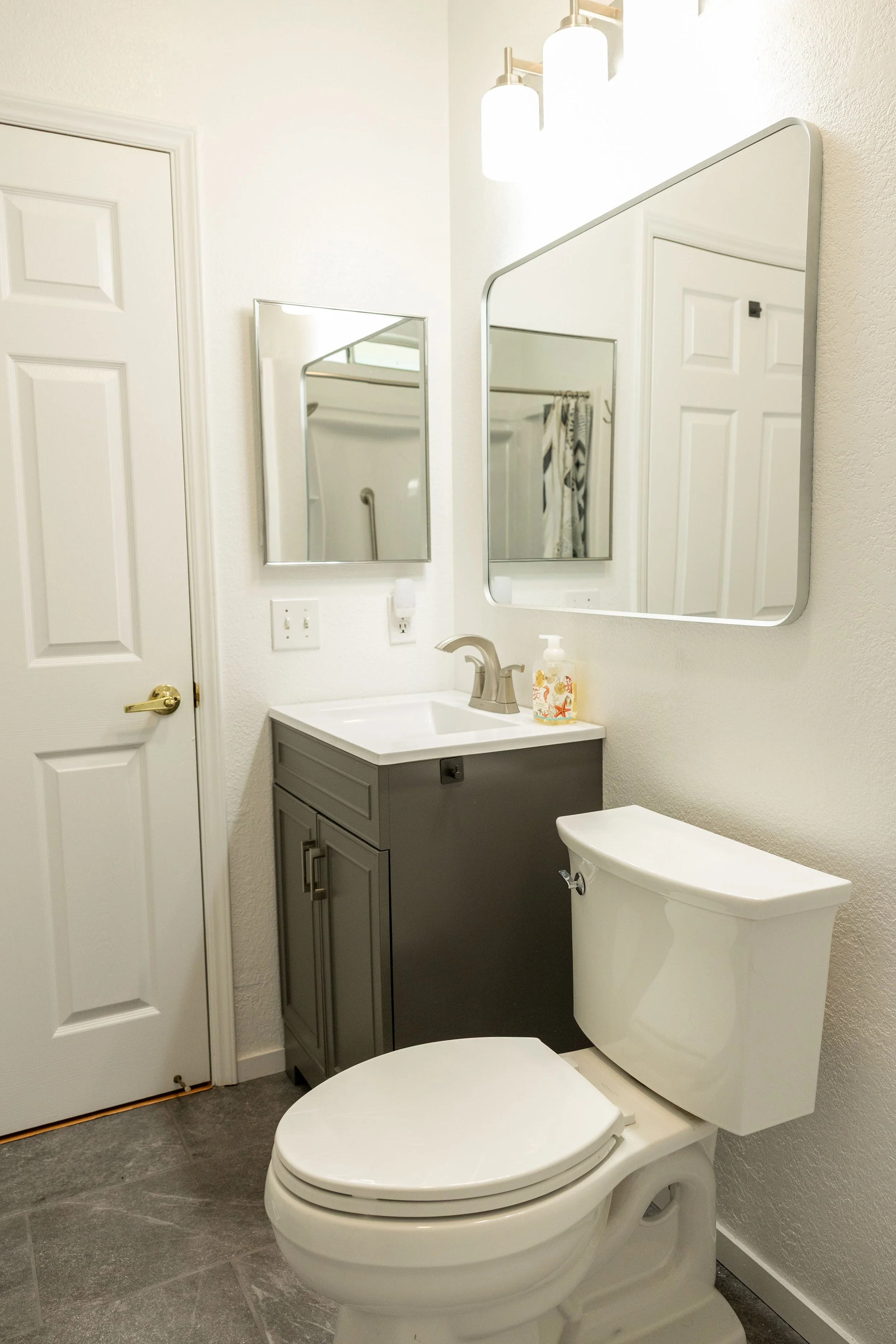 Bathroom remodel with ada compliant shower new toilet new sink new vanity new lights