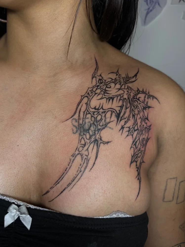 Detailed dragon tattoo on the upper chest by Summer
