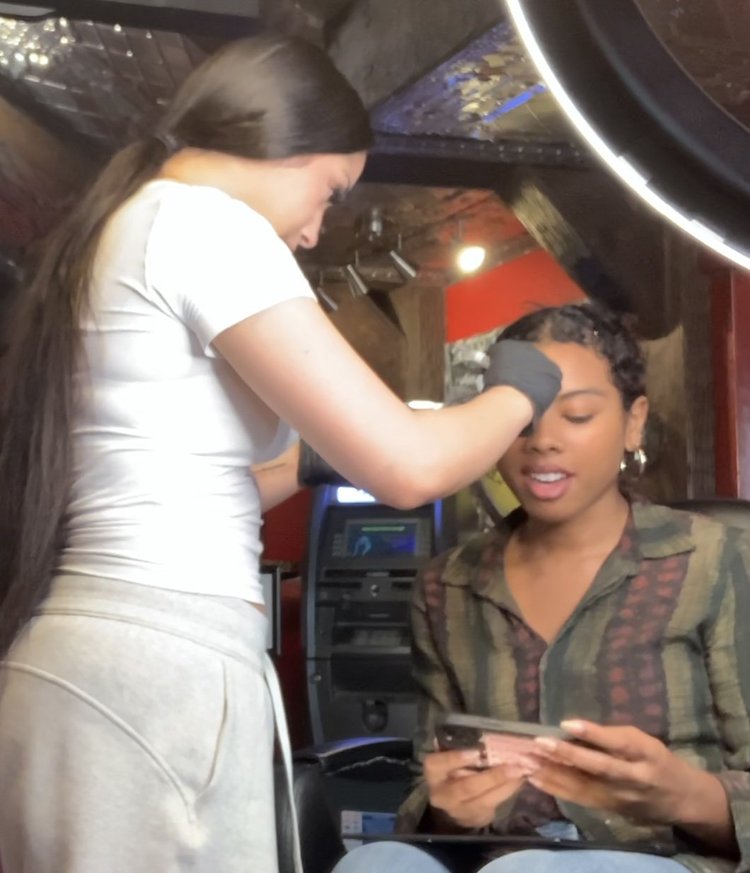 Amaris, professional piercer at Red Ink Tattoo Studio, at work