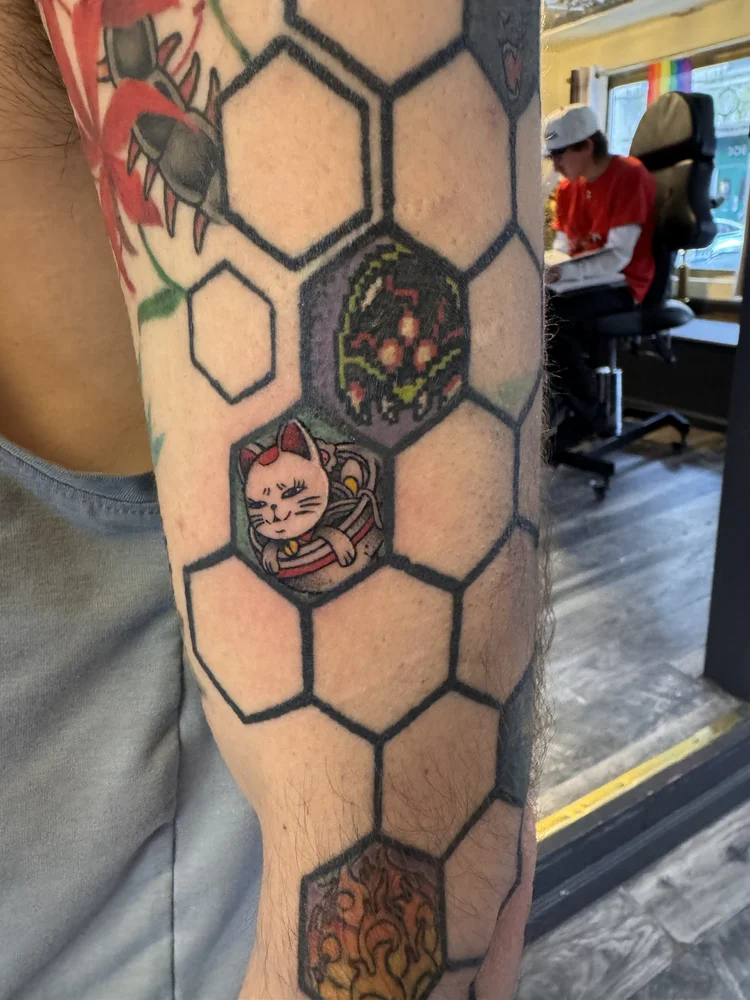 Color flash tattoo work at Red Ink Tattoo Studio