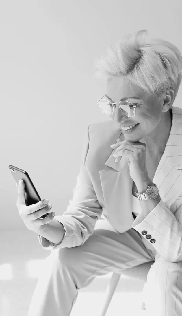 Executive sitting in luxurious office reviewing the impact of website strategy implementation