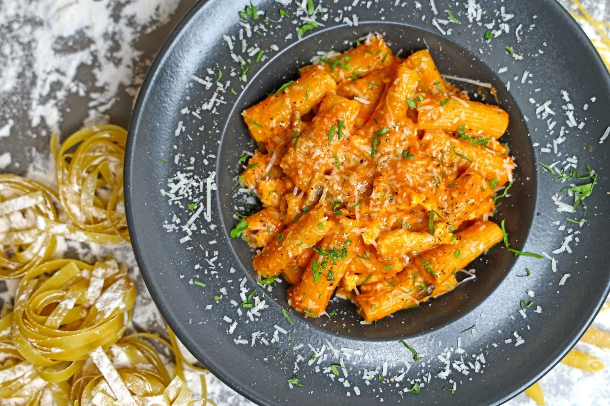 Carb loading pasta dinner with rigatoni and tomato sauce before a marathon race