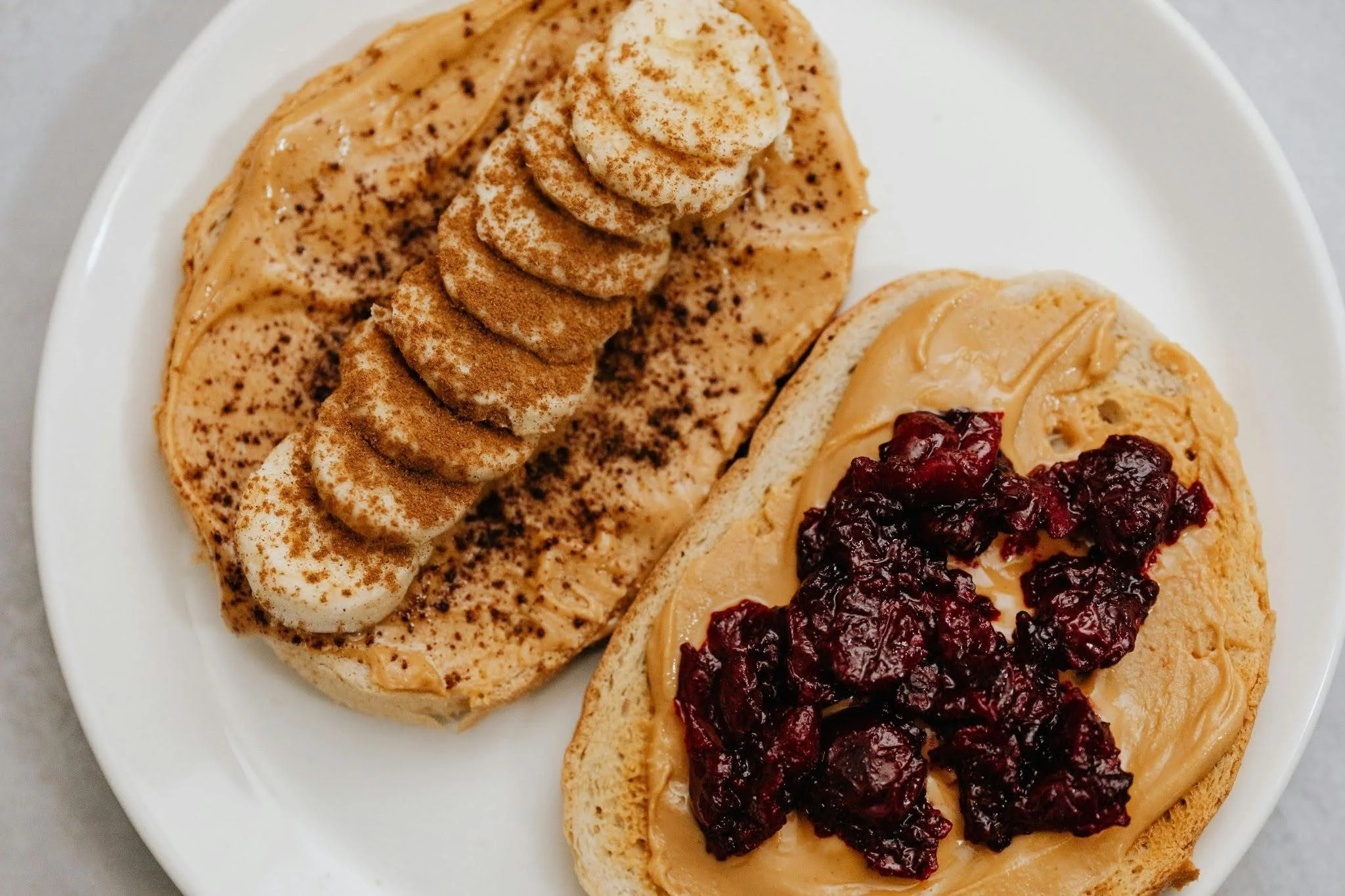 Pre-marathon breakfast of peanut butter toast with banana and jam for fueling before a long run