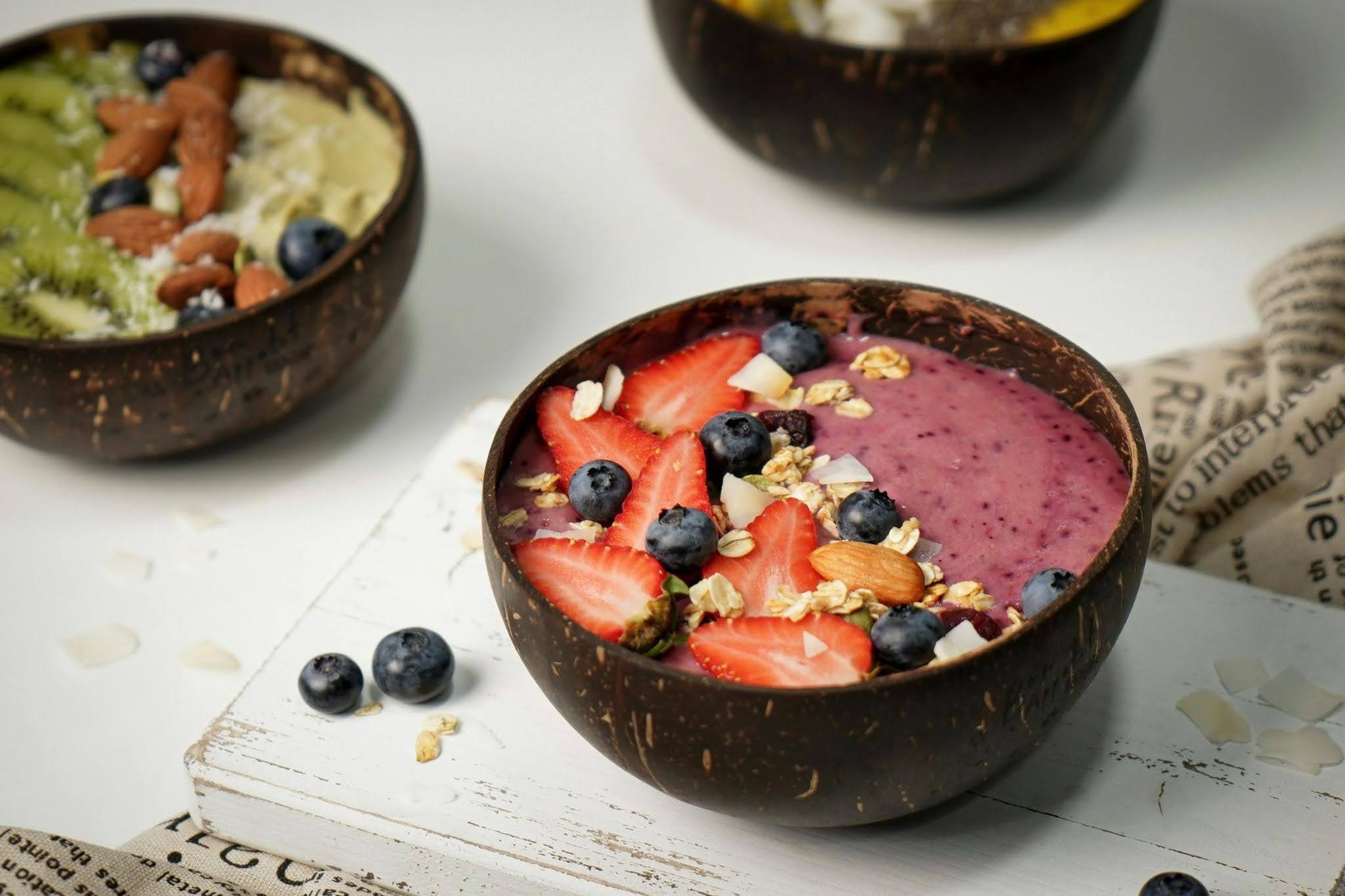Post-marathon recovery smoothie bowl with berries, granola, and almonds for refueling after a long run
