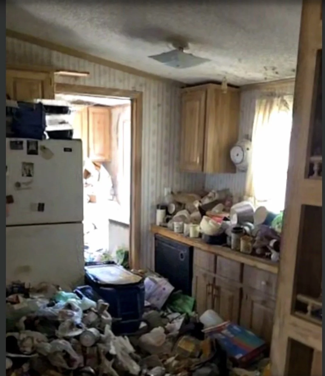 An image of the kitchen prior to renovation on the manufactured house we recently made a hard money loan against in Belen New Mexico